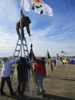 the group I was honored to accompany to Stand Rock hanging their flag
